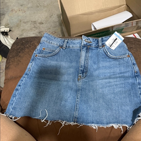 Topshop Dresses & Skirts - Topshop Denim Skirt is a blue mini skirt raw hem and five-pocket styling size 8